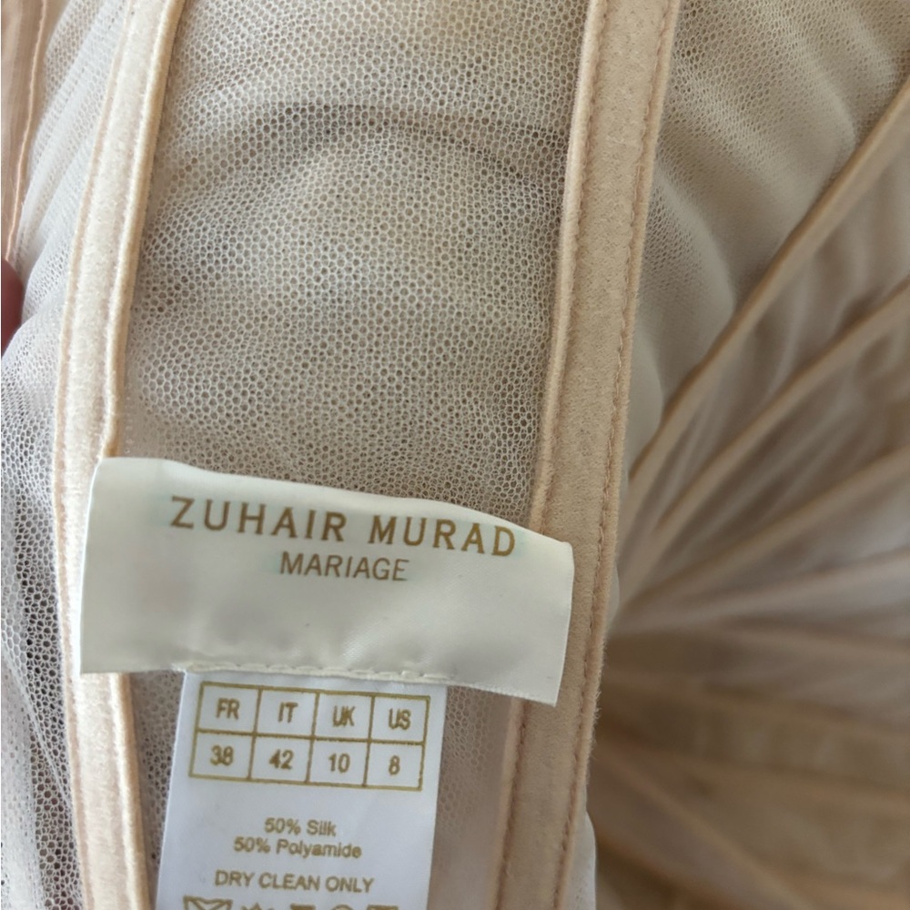 Elegant Cream Tulle Gown

Zuhair MuradRuffled Tulle Wedding Dress Size 8 - Picture 7 of 16